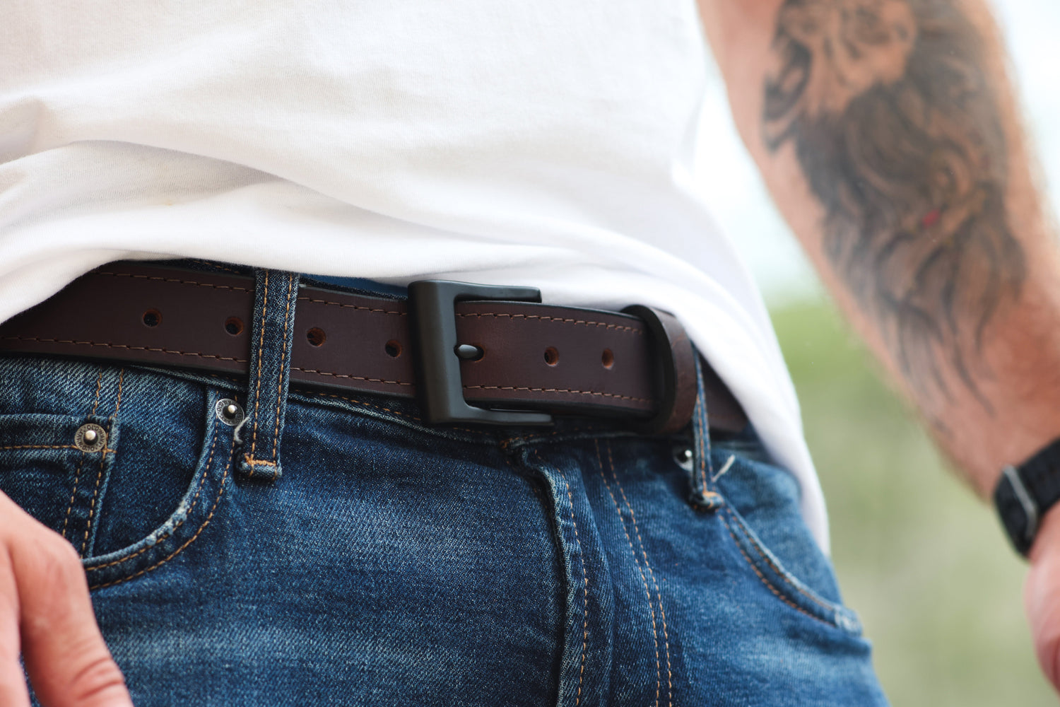 The Guardian full-grain leather belt worn with jeans