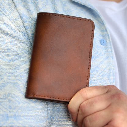 The Ambassador passport holder in Brown, closed detail