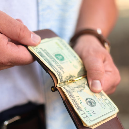 The Congress money clip wallet, brass clip holding cash