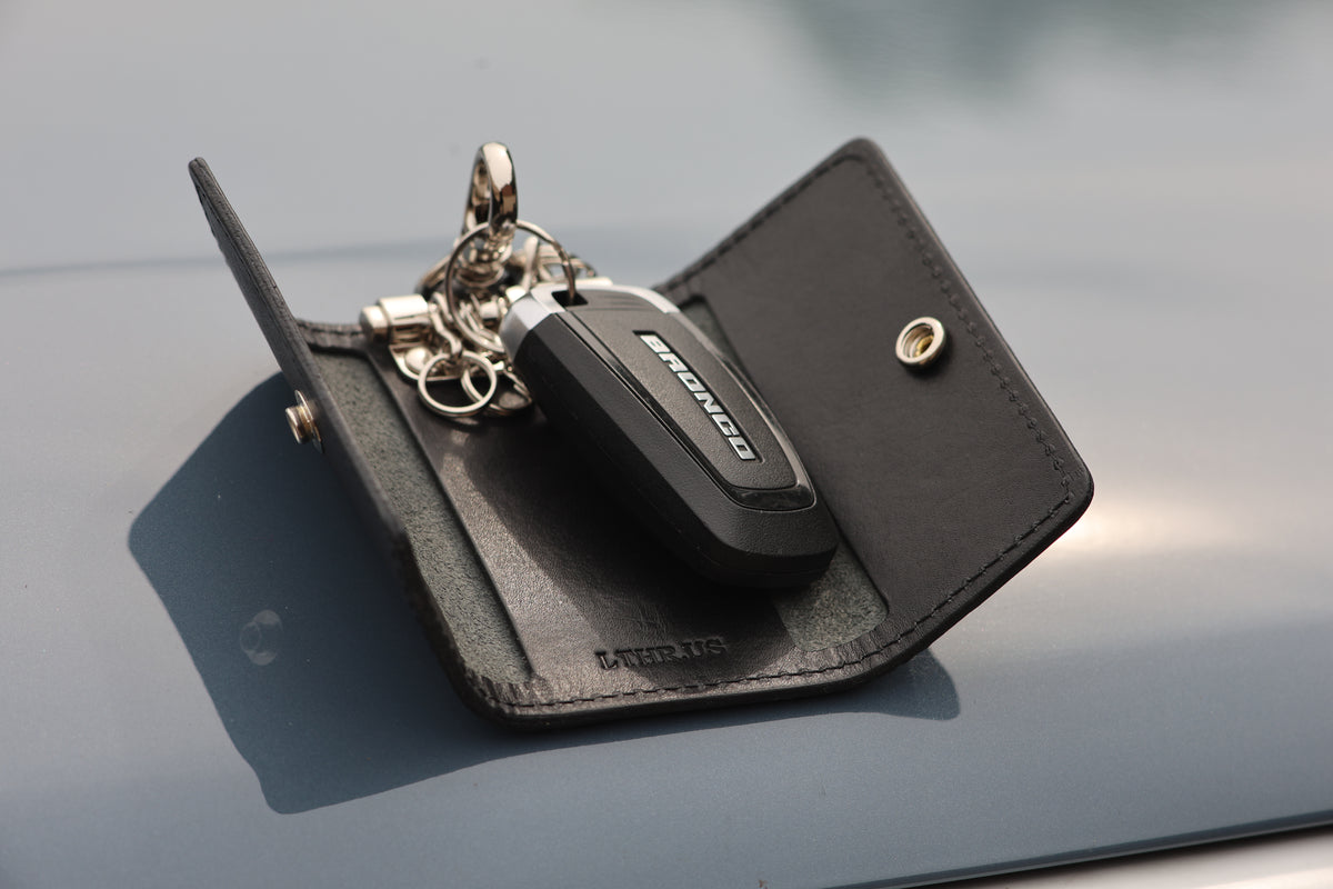 The Fort Wayne trifold key wallet in Black, open at an angle