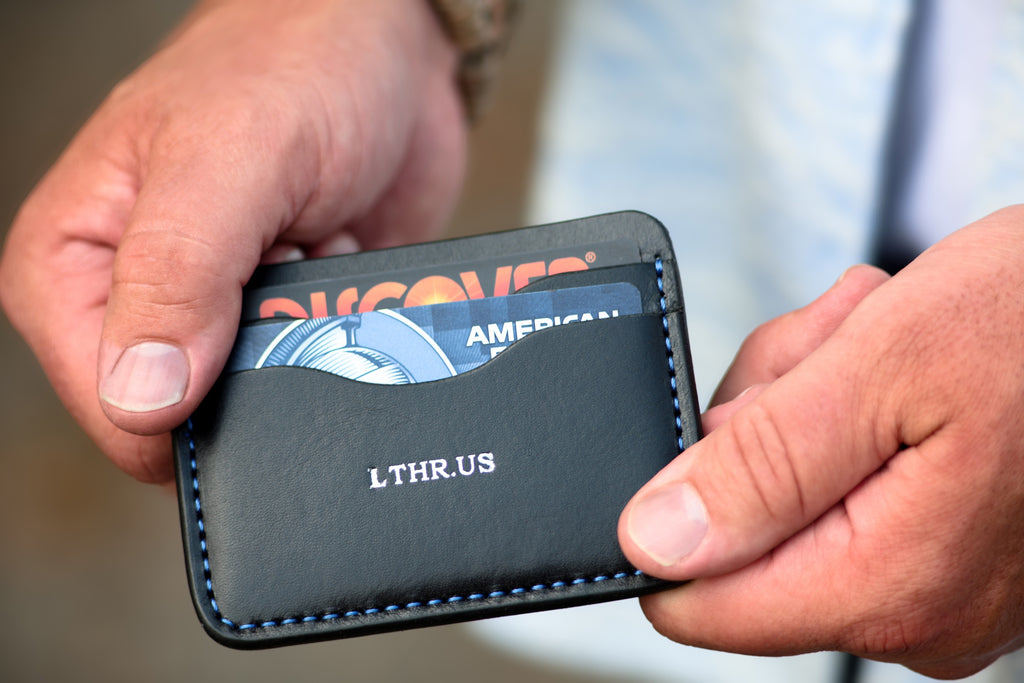 The Townsend card wallet in Black with blue contrast stitching