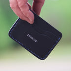 The Townsend card wallet in Black, in hand