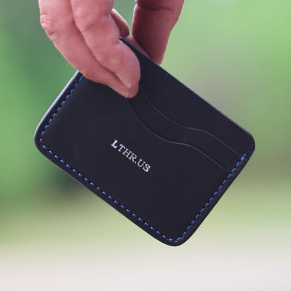 The Townsend card wallet in Black, in hand