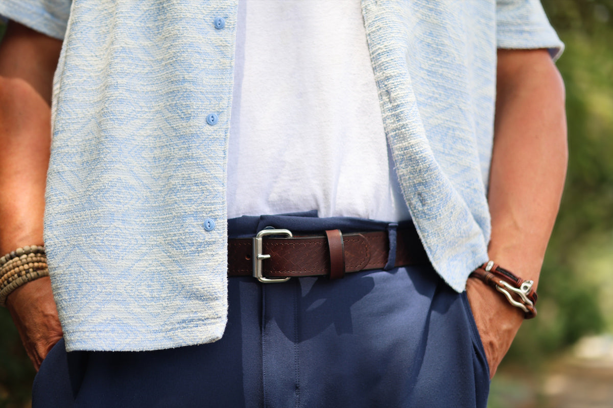 The Woodward basket weave belt in Brown, worn outdoors