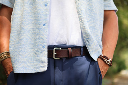 The Woodward basket weave belt in Brown, worn outdoors